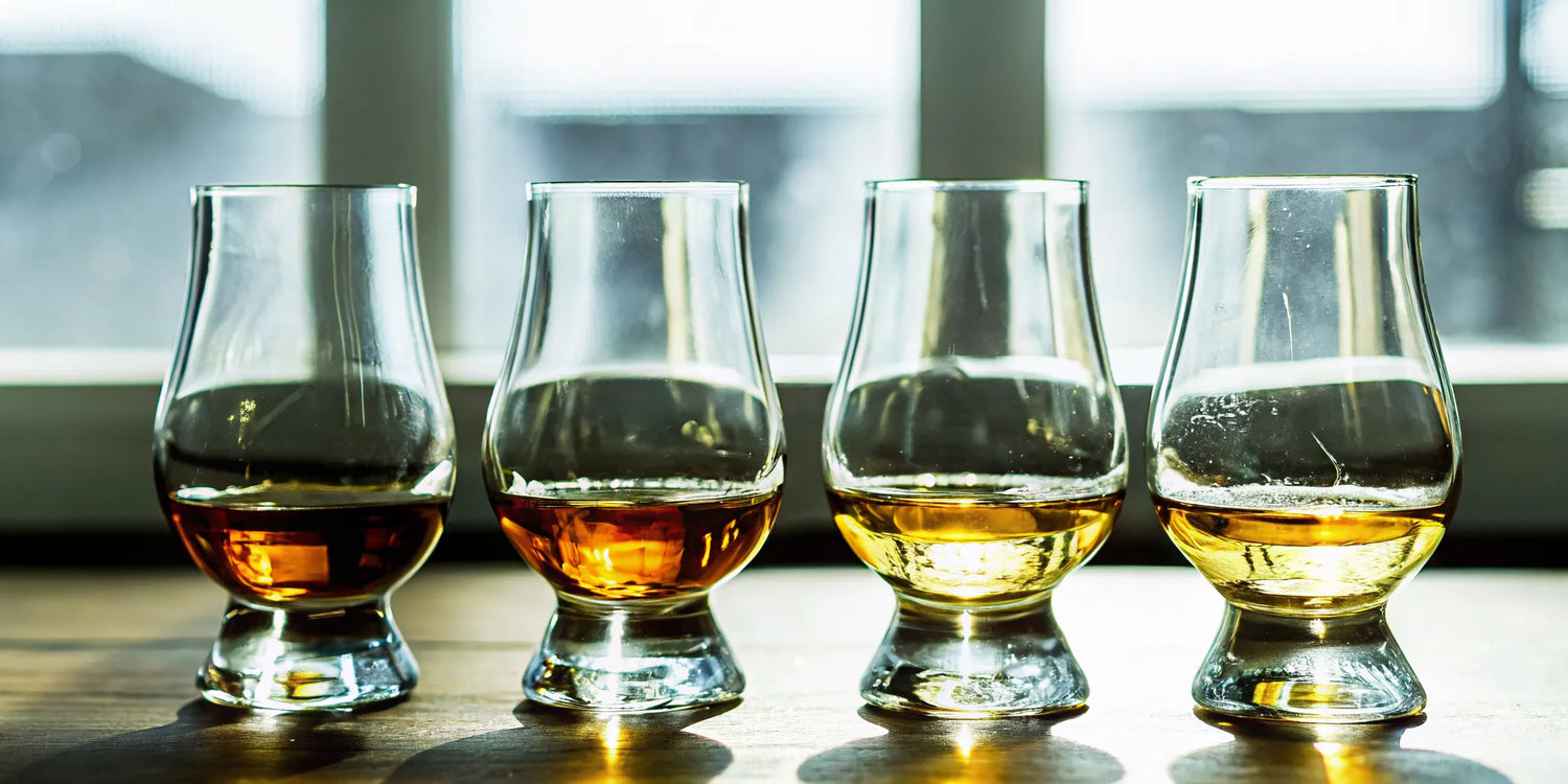 A tequila flight showing different colors and styles, ready to sip and compare tasting notes.