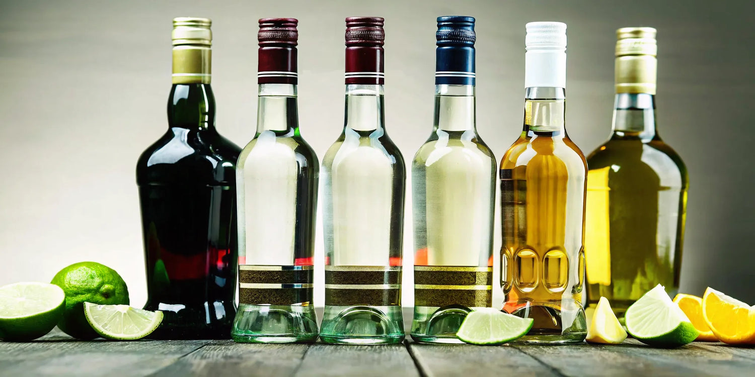 Bottles of the best sipping tequila for the money, with fresh lime slices nearby.