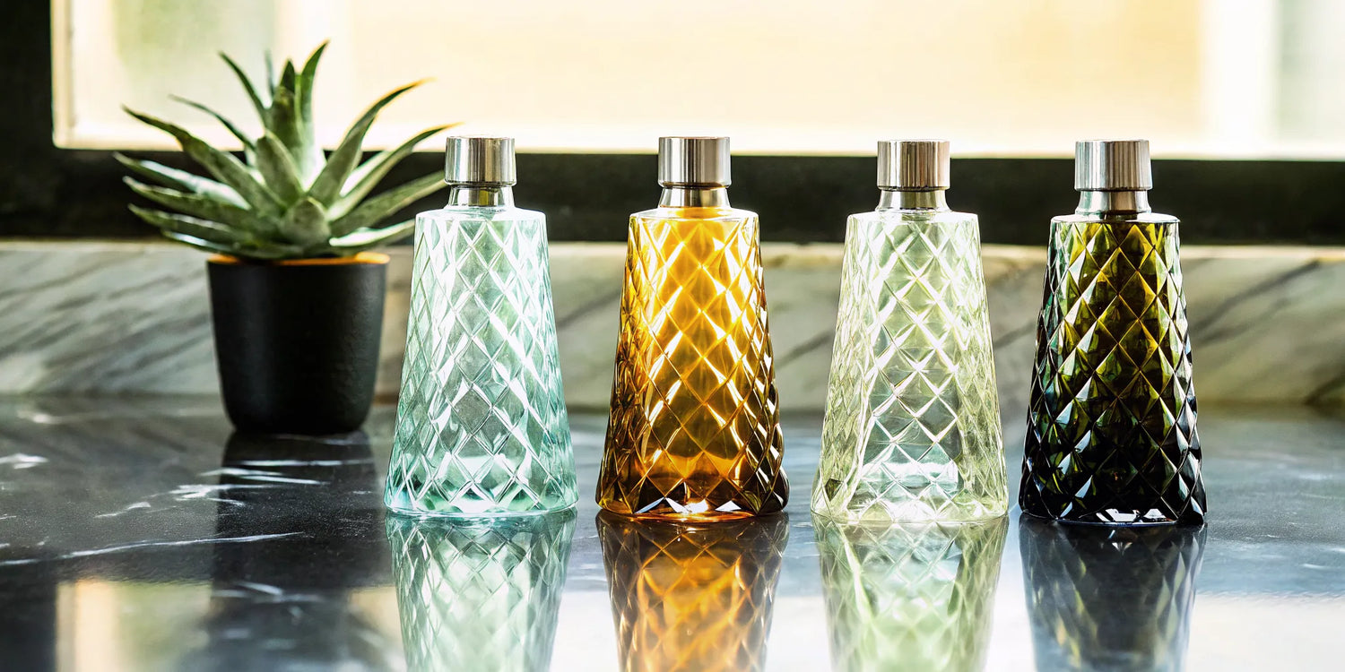 A lineup of four of the best top shelf tequila bottles.