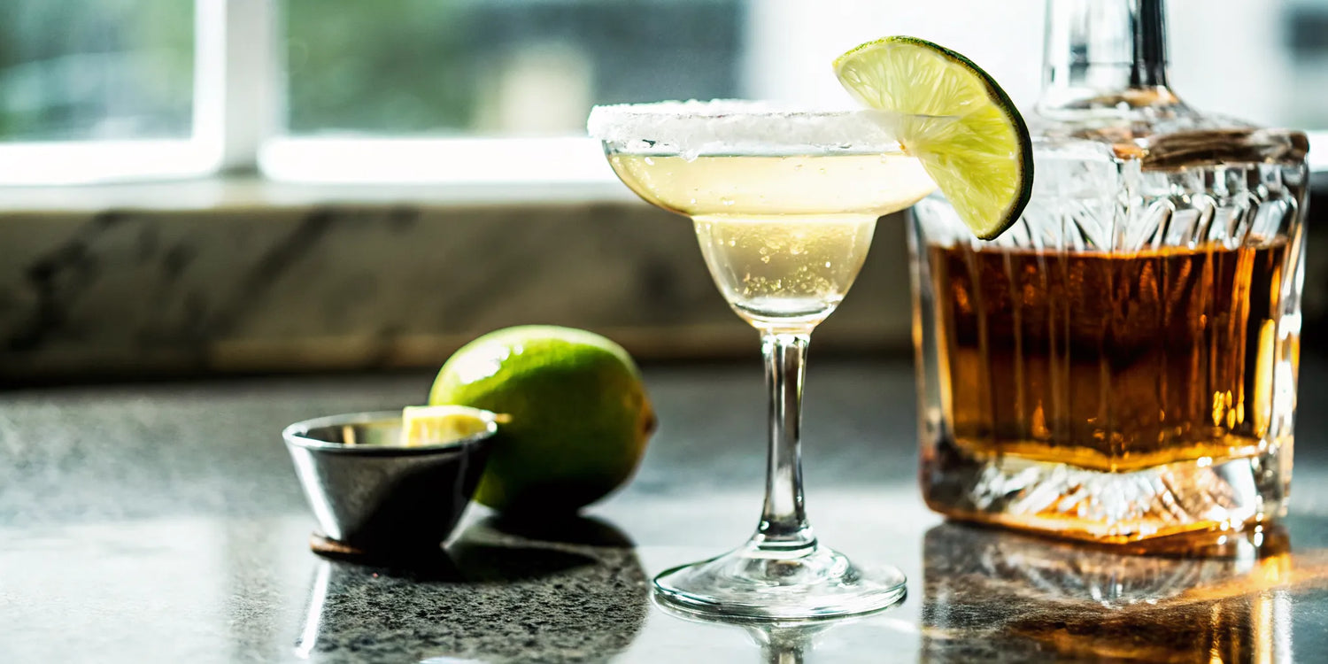 Best reposado tequila for margaritas beside a neat tasting glass