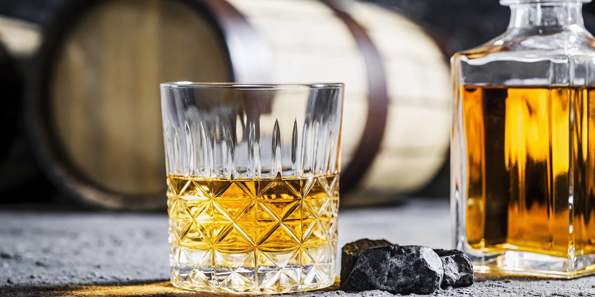 Crystal clear Cristalino tequila in a glass with warm barrel-aged tones in the background