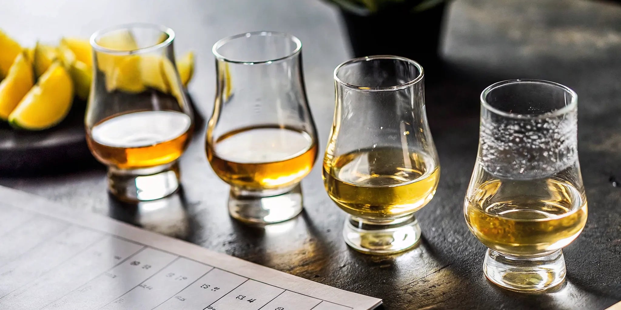 Elegant tequila tasting at home setup with glasses and scorecards