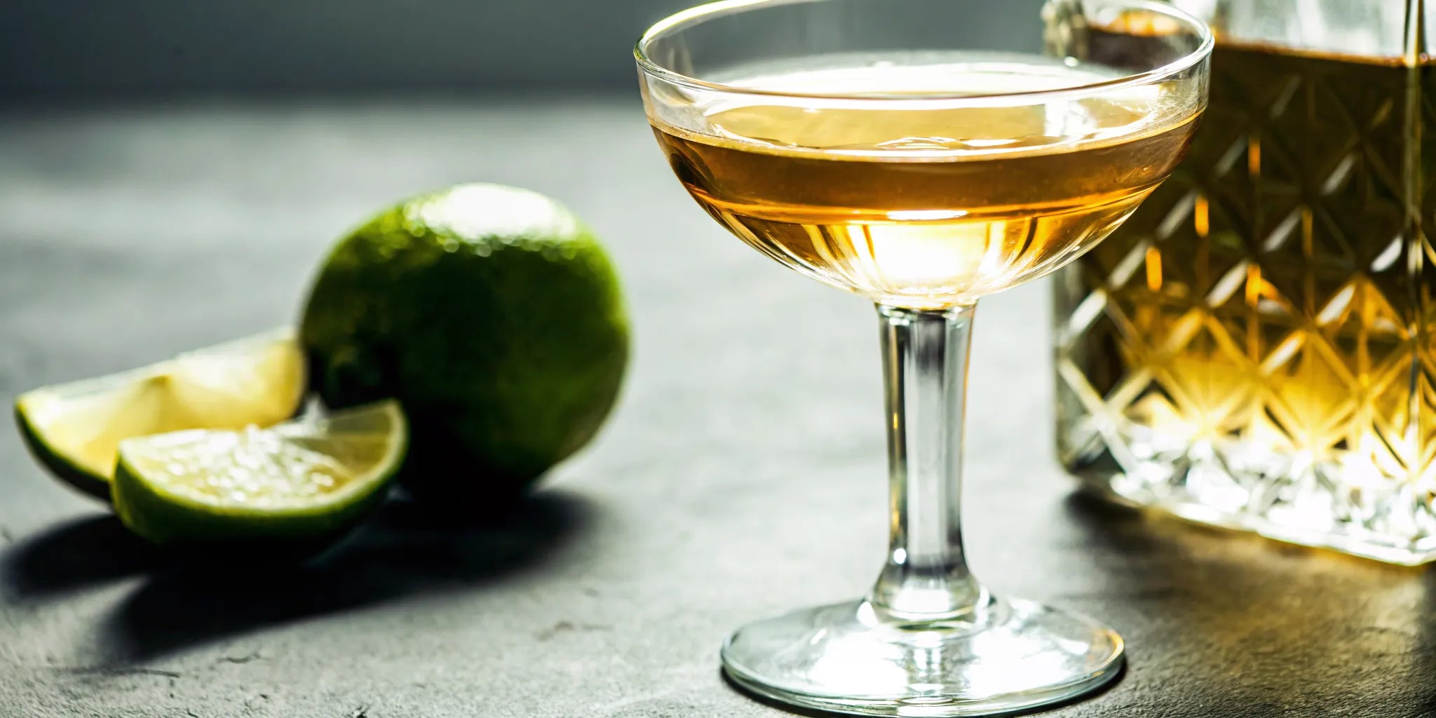 The smoothest tequila for sipping in a coupe glass with lime and a decanter.